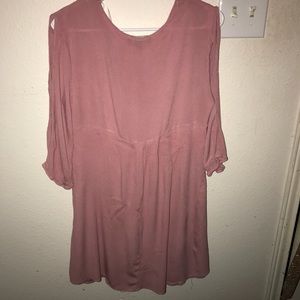 A dress that is mid thigh. Has open arm slits